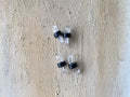 May include: Four clear plastic eyeglass holders with black rubber bands. The holders are designed to keep glasses from sliding down or dropping.