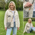 Woman outdoors wearing light jacket and jeans with a grey macrame crossbody phone bag